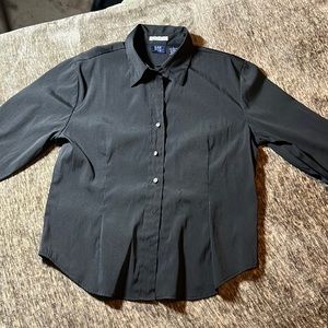 Long sleeve shirt with buttons missing is in ok condition and has a collar